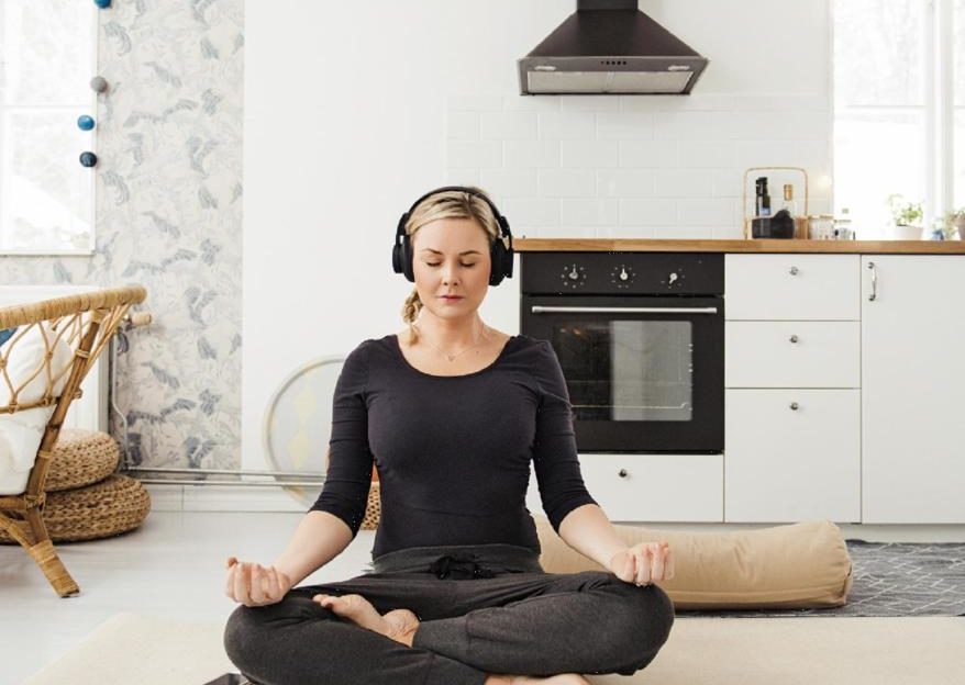 woman meditating at home stress relief